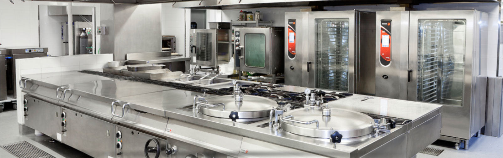 Commercial kitchen with stainless steel appliances and equipment